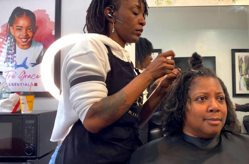 Taniesa Taylor, the owner of Locs, Twists, Braids and Crochets in Columbus, Georgia styles Shawnitra Williams’ hair recently. 01/11/2024