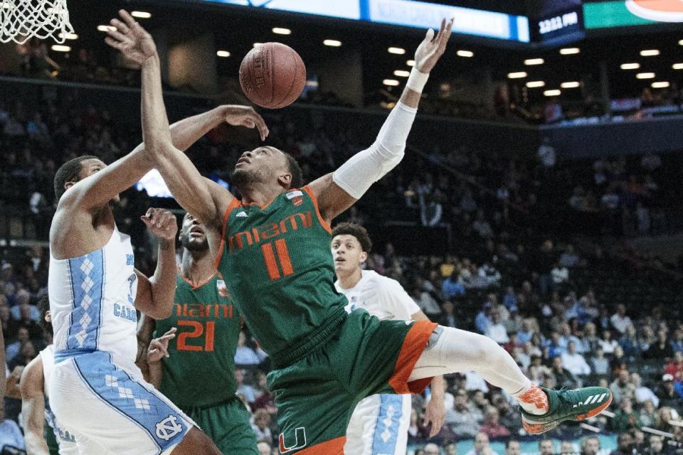 North Carolina forward Kennedy Meeks, left, stops Miami guard Bruce Brown (11) from scoring during the first half of an NCAA college basketball game in the Atlantic Coast Conference tournament, Thursday, March 9, 2017, in New York. (AP Photo/Mary Altaffer)