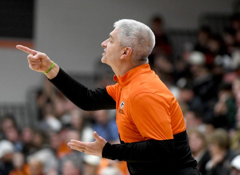 Green head coack Mark Kinsley talks to players in the second quarter of Jackson at Green boys basketball. Friday, December 8, 2023.