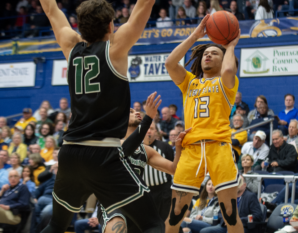 Kent State's Jalen Sullinger (right) takes a shot with Cleveland State's Dylan Arnett defending during Saturday's game.