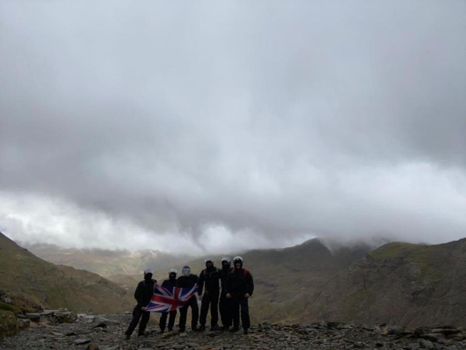 The officers unfurled a Union Jack as they reached the summitMet Police