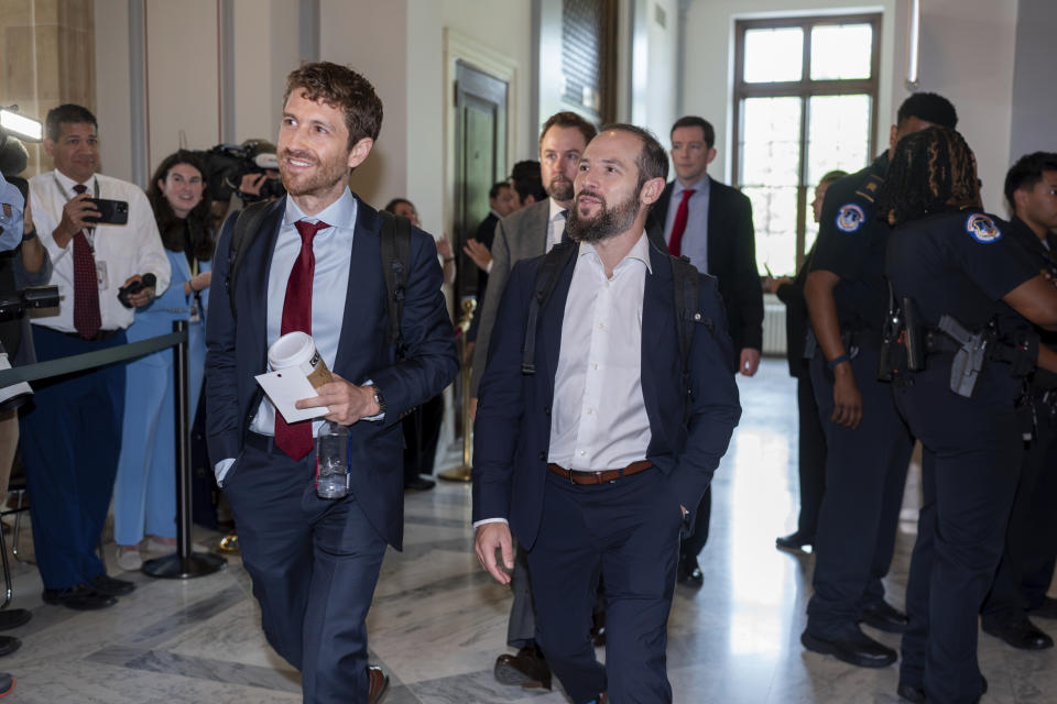 Tristan Harris, left, and Aza Raskin, co-founders of the Center for Humane Technology, arrive as Senate Majority Leader Chuck Schumer, D, N.Y., convenes a closed-door gathering of leading tech CEOs to discuss the priorities and risks surrounding artificial intelligence and how it should be regulated, at the Capitol in Washington, Wednesday, Sept. 13, 2023. (AP Photo/J. Scott Applewhite)