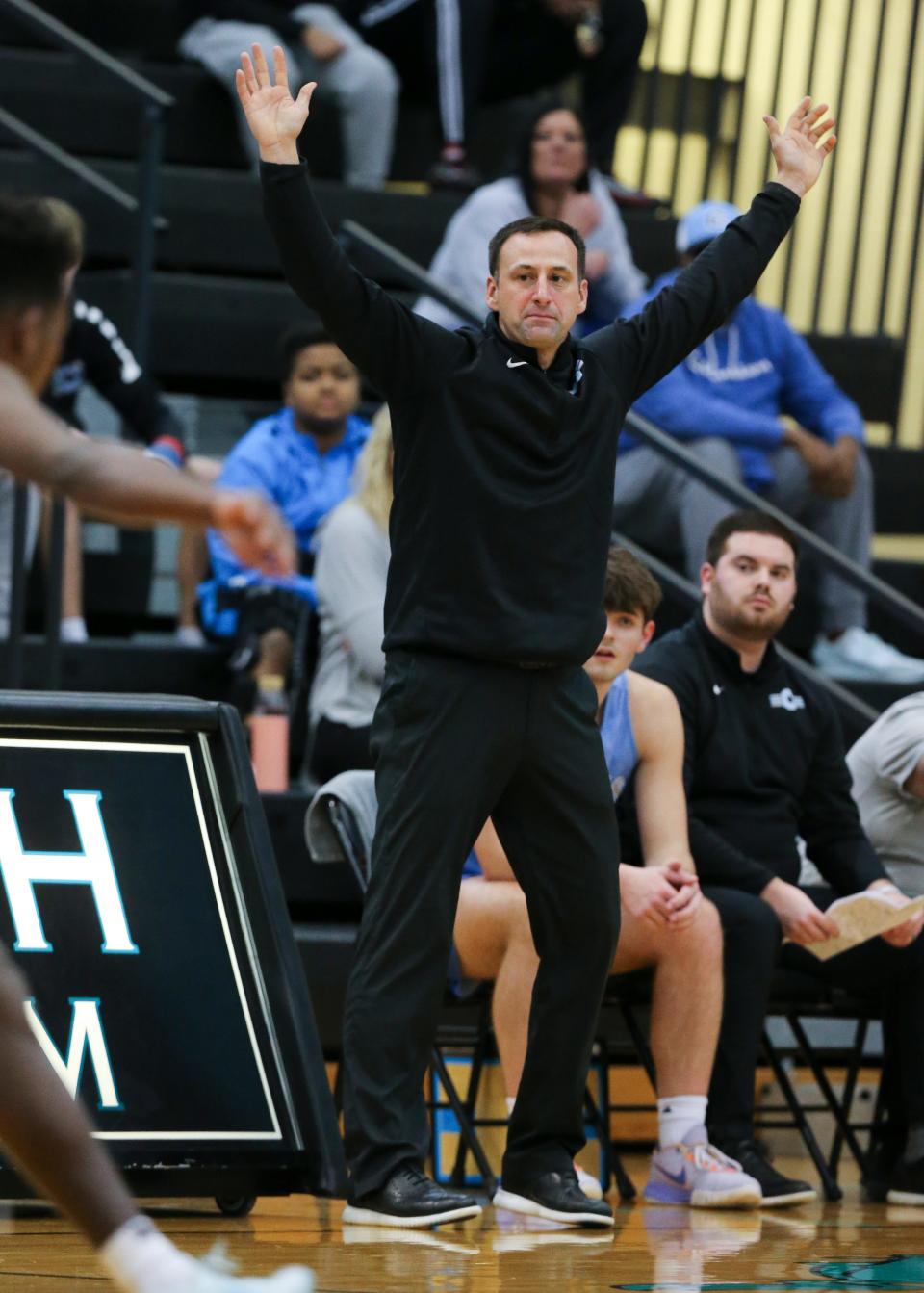 Collins head coach Chris Gaither tells his team to get their hands up on defense against North Oldham during their game at North Oldham High School in Goshen, Ky. on Feb. 14, 2023.  