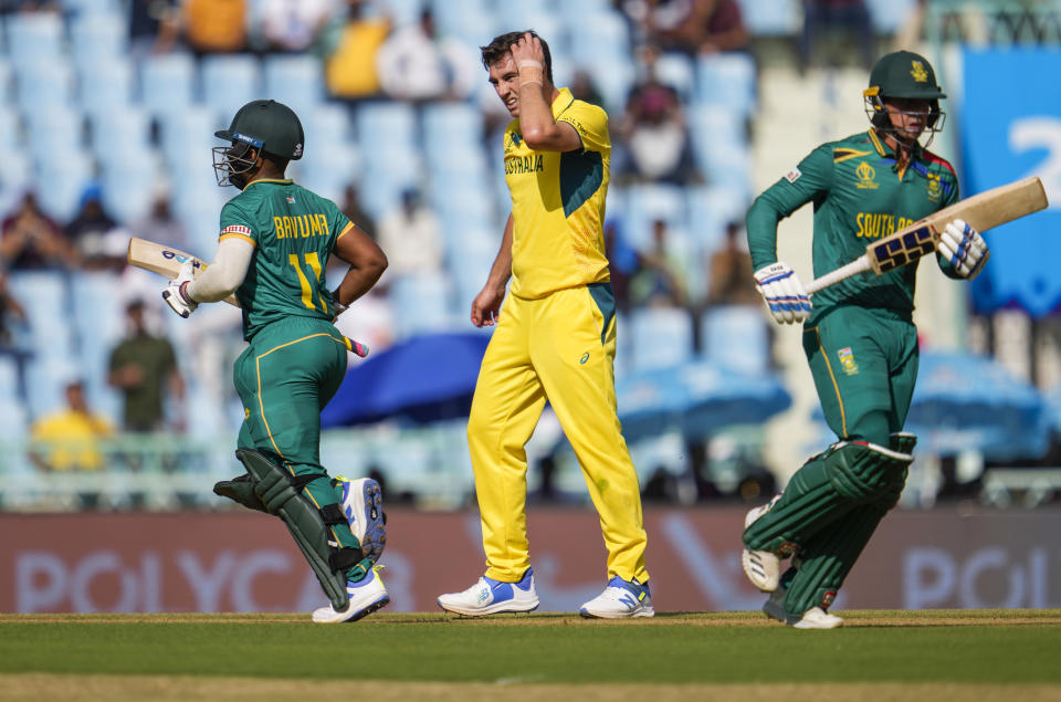 South Africa's captain Temba Bavuma and Quinton De Kock run between the wickets during the ICC Cricket World Cup match between Australia and South Africa in Lucknow, India, Thursday, Oct. 12, 2023. (AP Photo/Altaf Qadri )