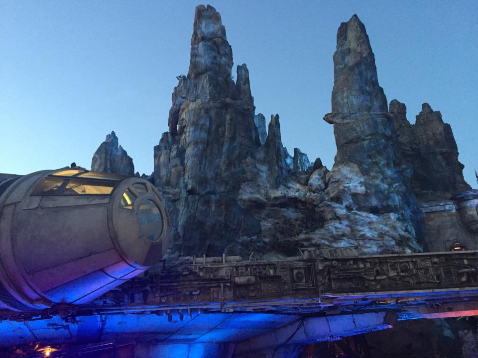 The Millennium Falcon seen in the evening at Star Wars: Galaxy's Edge.