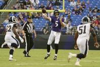 Aug 9, 2018; Baltimore, MD, USA; Baltimore Ravens quarterback Joe Flacco (5) throws as Los Angeles Rams defensive tackle Tanzel Smart (92) and linebacker Ejuan Price (51) defend during the first quarter at M&T Bank Stadium. Tommy Gilligan-USA TODAY Sports