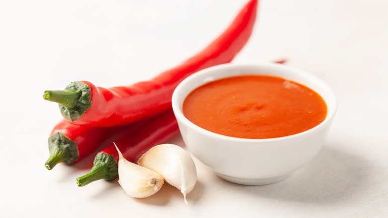 sriracha and ingredients on table