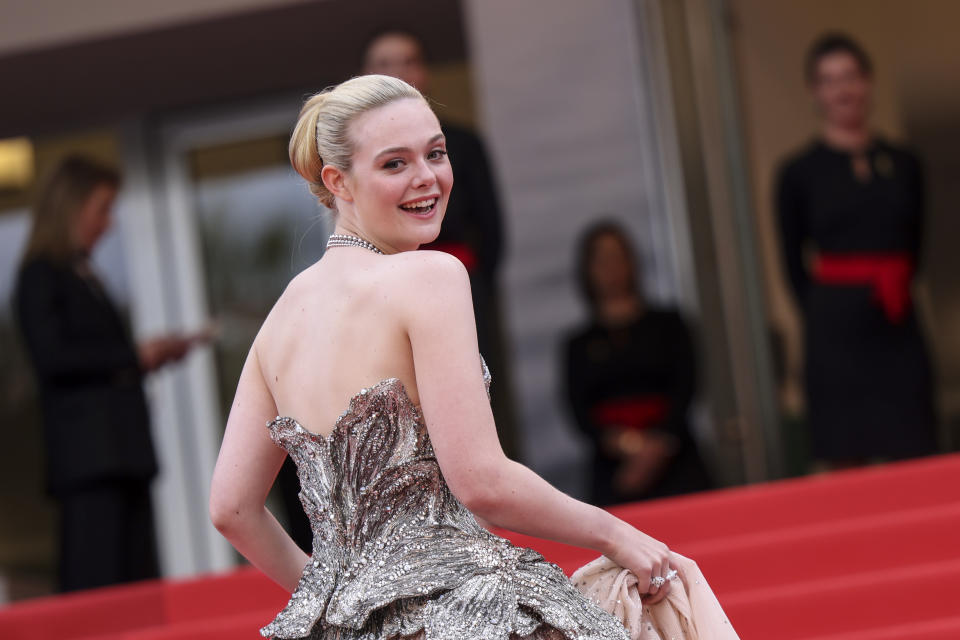 Elle Fanning poses for photographers upon arrival at the opening ceremony and the premiere of the film 'Jeanne du Barry' at the 76th international film festival, Cannes, southern France, Tuesday, May 16, 2023. (Photo by Vianney Le Caer/Invision/AP)