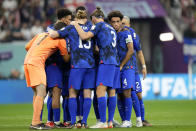 The players of the United States gather together on the pitch at the start of the second half during the World Cup group B soccer match between England and The United States, at the Al Bayt Stadium in Al Khor , Qatar, Friday, Nov. 25, 2022. (AP Photo/Luca Bruno)