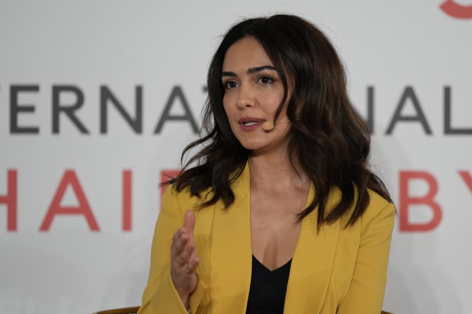Actor Nazanin Boniadi talks during the International Women's Day in Abu Dhabi, United Arab Emirates, Wednesday, March 8, 2023. Boniadi is urging the world to back the protests in her native Iran calling for women's rights and political change, saying despots fear nothing "more than a free and politically active woman." (AP Photo/Kamran Jebreili)