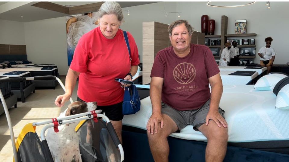 Palm Coast residents Gerry and Antonia Agerbeck and their dog Sadie (in the stroller) check out the new Rooms To Go store at Tomoka Town Center in Daytona Beach on Thursday, June 23, 2022. The 3-in-1 home-furnishings store, which includes Rooms To Go Kids and Rooms To Go Patio, is set to hold its grand opening on Saturday, June 25.