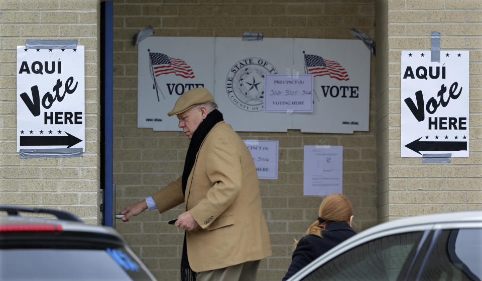 Voters arrive at a polling site, Tuesday, March 4, 2014, in San Antonio. Texas is holding the nation's first primary election Tuesday with a political free-for-all in Republican races that could push the state further right, though Democrats are calling it the next big battleground on the electoral map. (AP Photo/Eric Gay)