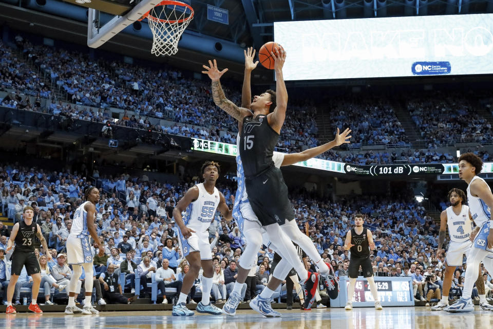 Virginia Tech's Lynn Kidd (15) attempts a shot during the second half of an NCAA college basketball game against North Carolina in Chapel Hill, N.C., Saturday, Feb. 17, 2024. (AP Photo/Ben McKeown)