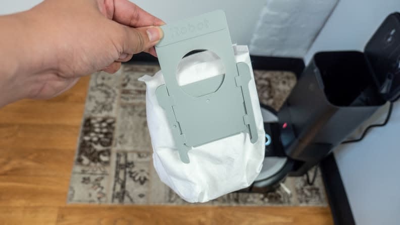 A vacuum in the charging base empties the i6+'s dust bin into a self-sealing bag.