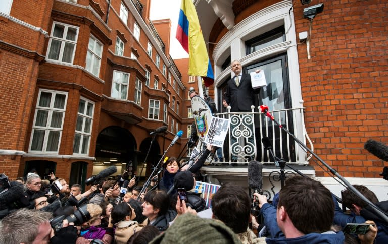 WikiLeaks founder Julian Assange (C) addresses media and supporters from the balcony of Ecuador's embassy in central London, on February 5, 2016