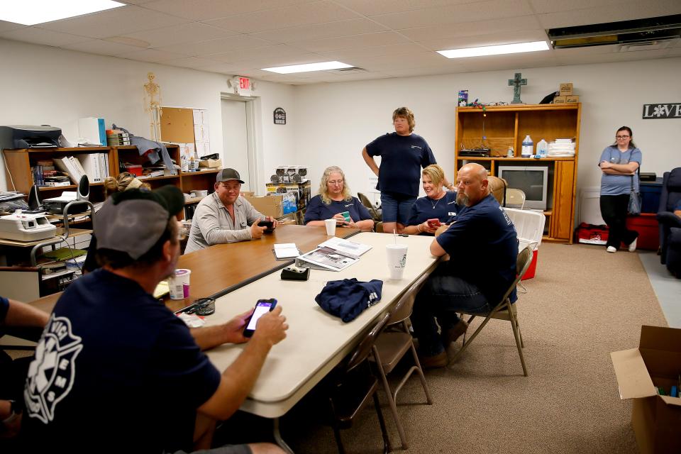 Members of the Vici-Camargo EMS crew sit inside their station in Vici on July 16.