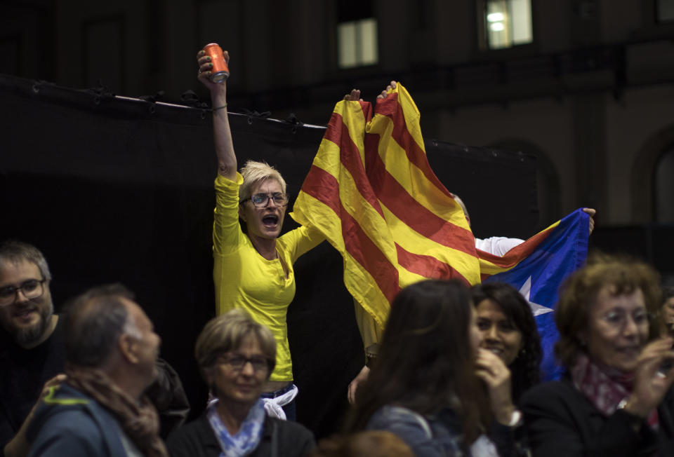 Supporters of Republican Left party of Catalonia celebrate the results of the general election in Barcelona, Spain, Sunday, April 28, 2019. Prime Minister Pedro Sánchez's party wins 129 seats and the far-left United We Can 33, still one dozen seats short of the 176 majority in Spain's Lower House. (AP Photo/Emilio Morenatti)