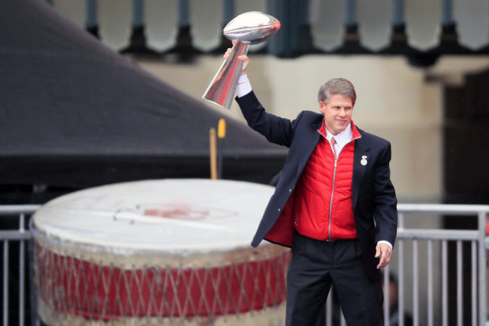 Kansas City Chiefs owner Clark Hunt holds the Super Bowl trophy during a rally in Kansas City, Mo., Wednesday, Feb. 5, 2020. (AP Photo/Orlin Wagner)