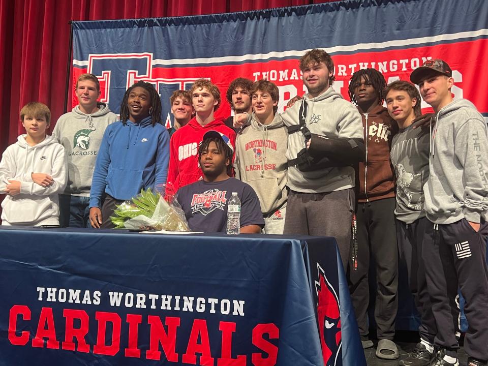 Thomas Worthington senior defensive tackle Francis Brewu signed his letter of intent with Pittsburgh on Wednesday. Brewu is shown with schoolmates.