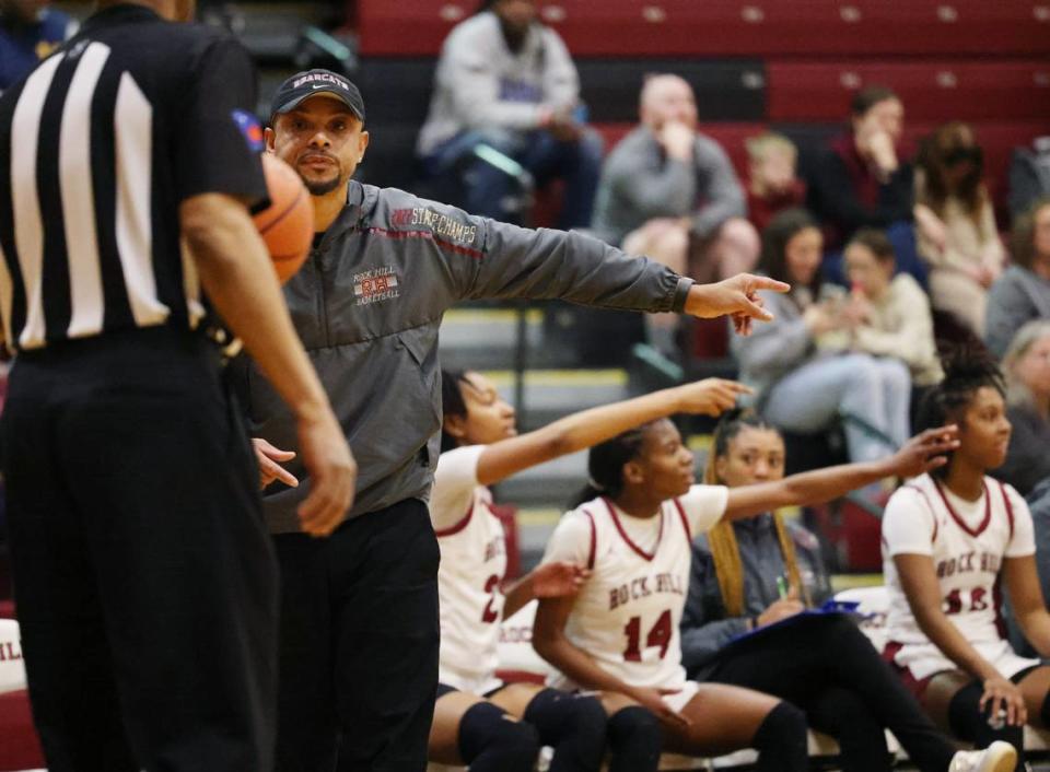 Rock Hill High School girls varsity basketball coach Kenny Orr talks to a referee Friday, Feb. 16, 2024.