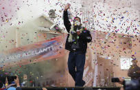 Bolivian presidential candidate for the Movement Towards Socialism Party, MAS, Luis Arce, waves to supporters during his closing campaign rally for the upcoming Oct. 18, presidential elections, in El Alto, Bolivia, Wednesday, Oct. 14, 2020. (AP Photo/Juan Karita)