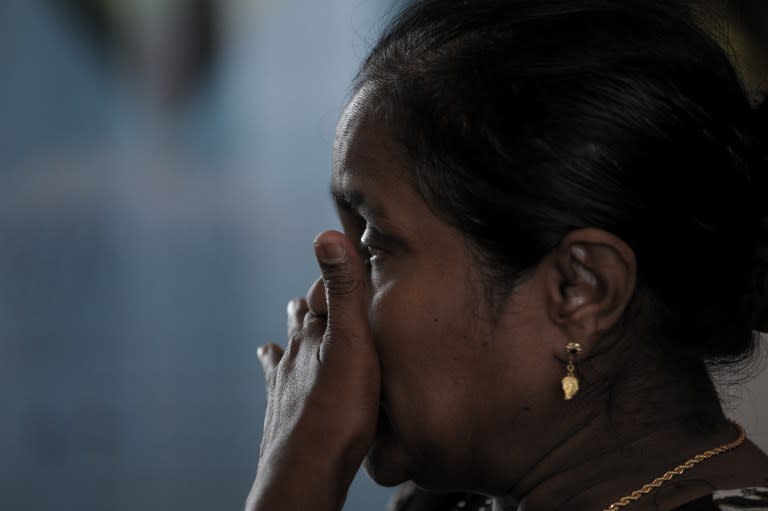 A relative of victims from the missing Malaysia Airlines Boeing 777-200 plane cries while awaiting updates at a hotel in Putrajaya, outside Kuala Lumpur on March 10, 2014.&nbsp;— AFP pic