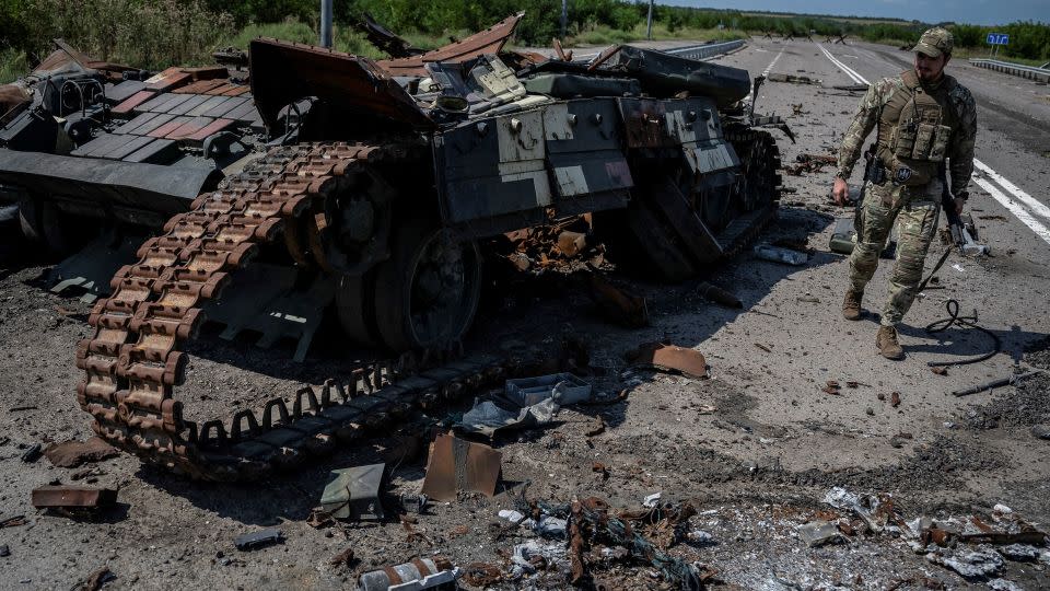 A Ukrainian serviceman walks near a destroyed Ukrainian tank near Robotyne in the Zaporizhzhia region, on August 25, 2023.  - Viacheslav Ratynskyi/Reuters