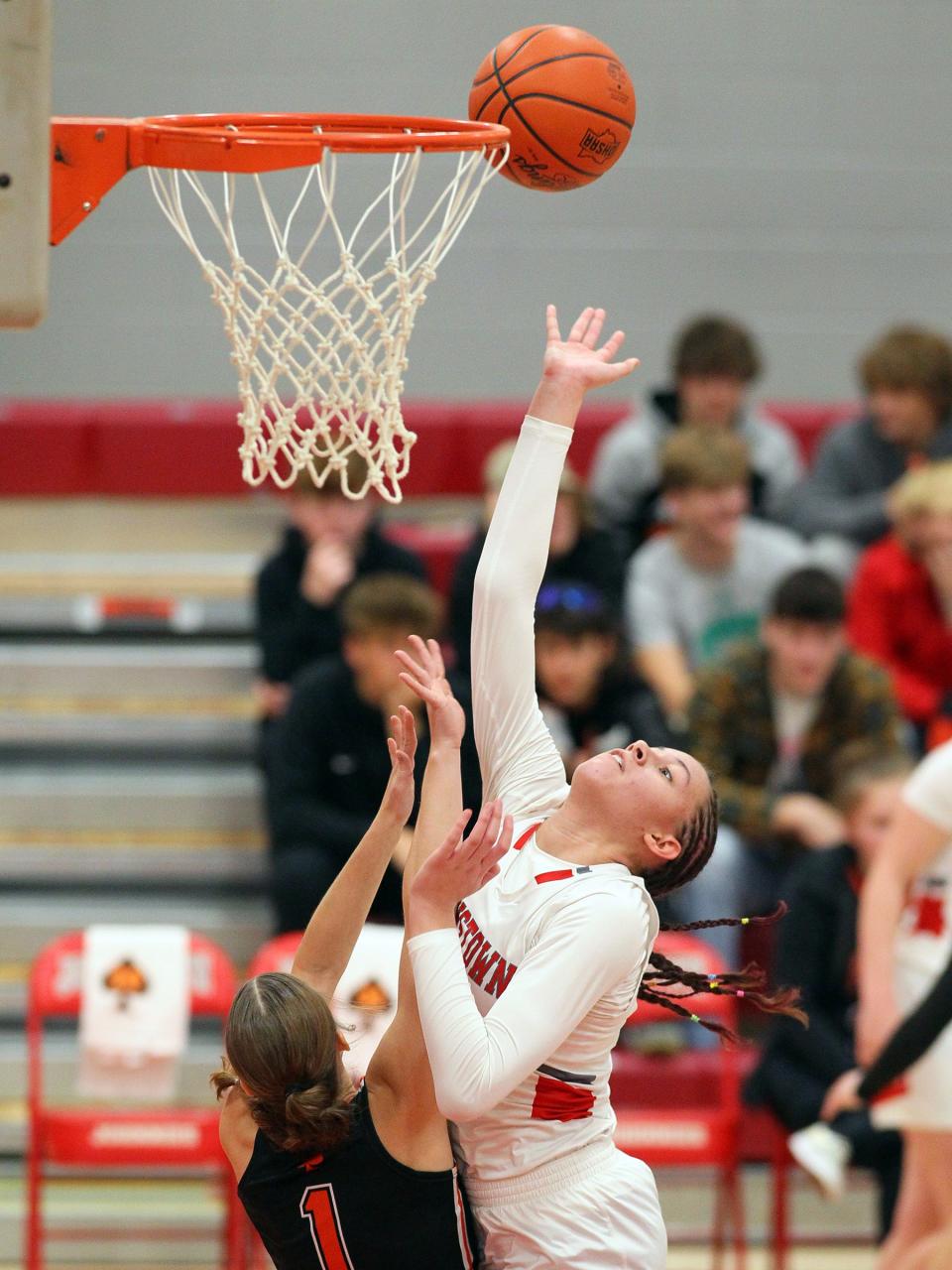 Johnstown's Kylie Sharp shoots a layup over an Amanda-Clearcreek defender on Wednesday.