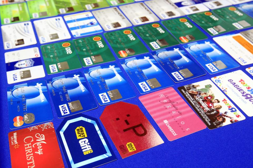 Credit cards that were confiscated are displayed at the McAllen Police Department in McAllen, Texas, after McAllen police arrested a man and a woman on fraud charges, Monday, Jan. 20, 2014. According to a South Texas police chief, the suspects used account information stolen during the Target security breach to buy tens of thousands of dollars' worth of merchandise, but a spokesman for the U.S. Secret Service said Tuesday that an investigation is ongoing into the possibility of a link between the Target data breach and the arrests. (AP Photo/The Monitor, Gabe Hernandez)