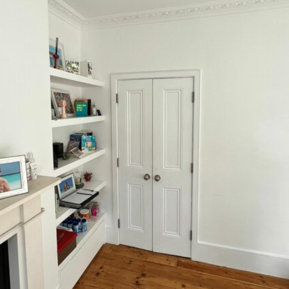 before shot of white bedroom walls and shelves