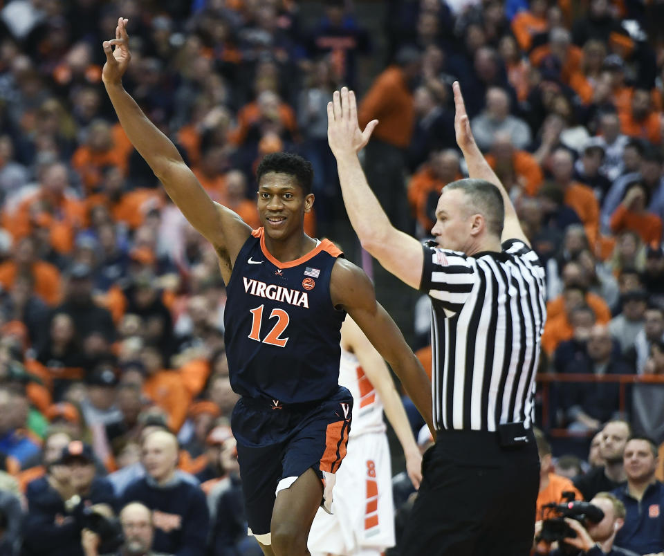 Virginia guard De'Andre Hunter celebrates a three-point basket during the second half of an NCAA college basketball game against Syracuse in Syracuse, N.Y., Monday, March 4, 2019. (AP Photo/Adrian Kraus)