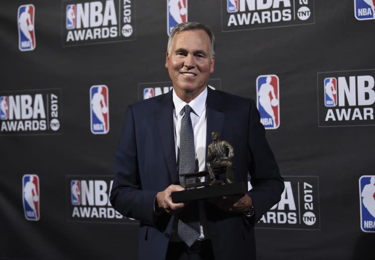 Mike D'Antoni shows off his 2017 Coach of the Year trophy. (AP)
