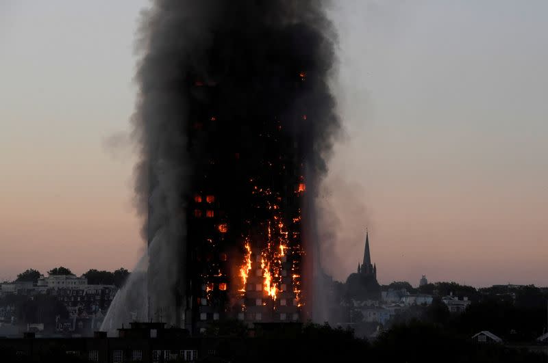 FILE PHOTO: Flames and smoke billow from the Grenfell Tower apartment block in West London,