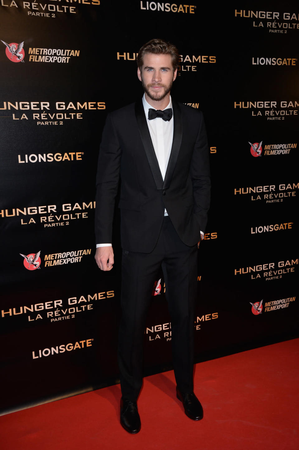 Liam Hemsworth in a black tux at the Paris premiere of “The Hunger Games: Mockingjay - Part 2.″