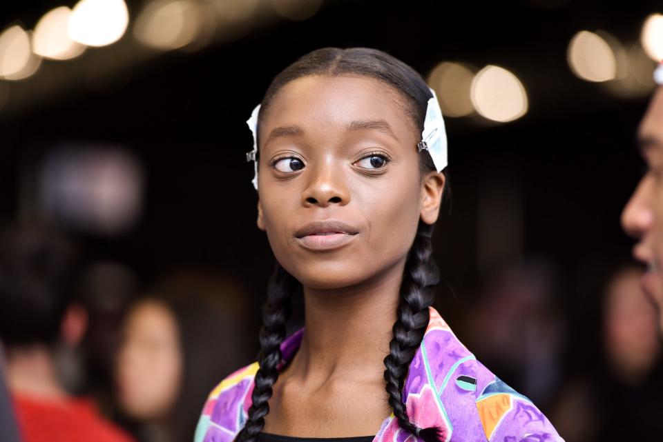 Model Olivia Anakwe poses at the 2016 KENZO x H&M Show - Backstage at Pier 36 on October 19, 2016.