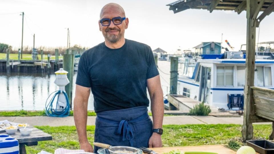 Host Michael Symon making Oyster and shrimp pan roast at Butts and Clucks Cook Off, Apalachicola, FL , as seen on BBQ USA, Season 2., (credit: Food Network)