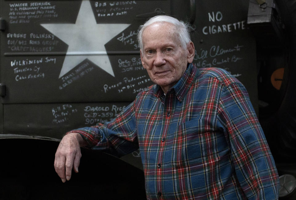 In this Tuesday, Dec. 10, 2019 photo, World War II and Battle of the Bulge veteran Arthur Jacobson, from Port St. Lucie, Florida, poses in front of a World War II vehicle at the Remember Museum 39-45 in Thimister-Clermont, Belgium. It was 75 years ago that Hitler launched his last desperate attack to turn the tide for Germany in World War II. At first, German forces drove so deep through the front line in Belgium and Luxembourg that the month-long fighting came to be known as The Battle of the Bulge. When the Germans asked one American commander to surrender, the famous reply came: “Nuts!" By Christmas, American troops had turned the tables on the Germans. Veterans are heading back this weekend and on Monday, Dec. 16, 2019 when they will mix with royalty and dignitaries to mark perhaps the greatest battle in U.S. military history. (AP Photo/Virginia Mayo)