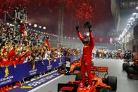 Sebastian Vettel gestures to the crowd after his win. (PHOTO: Singapore GP)