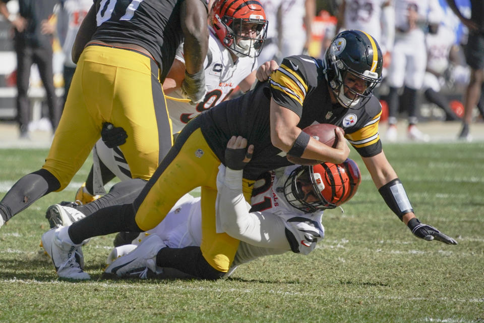 Cincinnati Bengals defensive end Trey Hendrickson (91) tackles Pittsburgh Steelers quarterback Ben Roethlisberger (7) during the second half an NFL football game, Sunday, Sept. 26, 2021, in Pittsburgh. (AP Photo/Gene J. Puskar)