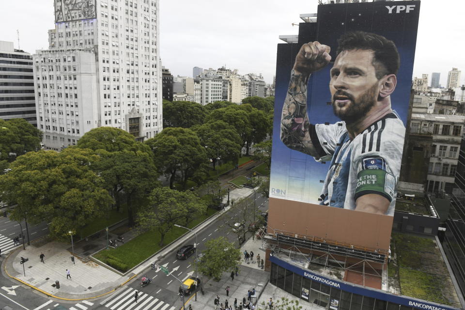 A new mural of soccer player Lionel Messi is unveiled in downtown Buenos Aires, Argentina, Dec. 18, 2023, one year after his national Argentine team won the World Cup tournament. (AP Photo/Gustavo Garello)