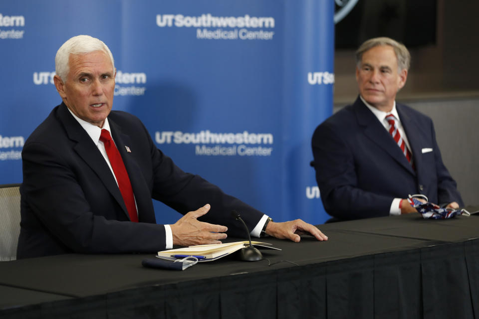 Vice President Mike Pence makes remarks as Texas Gov. Greg Abbott looks on during a news conference after Pence met with Abbott and members of his healthcare team regarding COVID-19 at the University of Texas Southwestern Medical Center West Campus in Dallas, Sunday, June 28, 2020. (AP Photo/Tony Gutierrez)