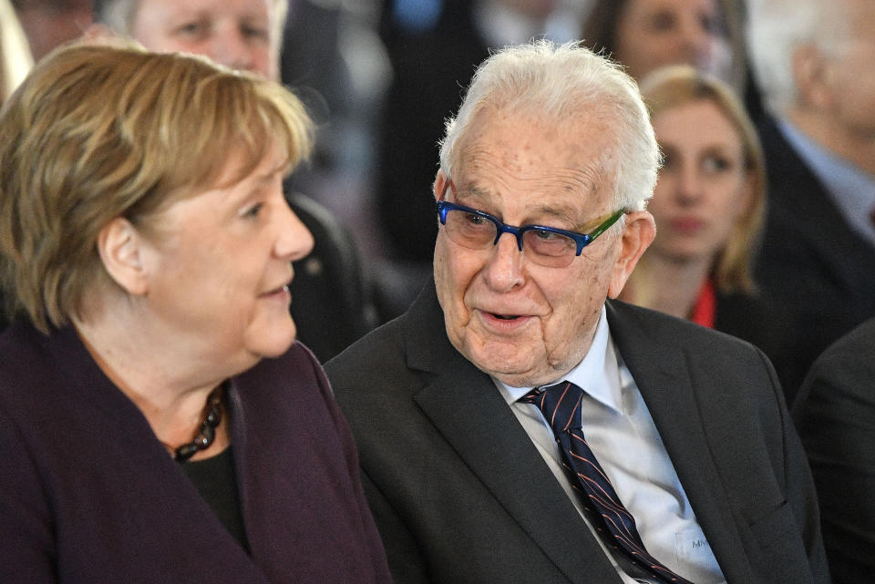 German chancellor Angela Merkel sits beside Holocaust survivor Naftali Furst, right, during the opening of the exhibition 'Survivors - Faces of Life after the Holocaust' at the former coal mine Zollverein in Essen, Germany, Tuesday, Jan. 21, 2020. The industrial world heritage landmark Zollverein shows 75 years after the liberation of the Nazi death camp Auschwitz-Birkenau, 75 portraits of Jewish survivors, photographed in Israel by German artist Martin Schoeller. (AP Photo/Martin Meissner)