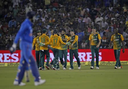 South African players celebrate the dismissal of India's Harbhajan Singh during their second Twenty20 cricket match in Cuttack, India, October 5, 2015. REUTERS/Danish Siddiqui