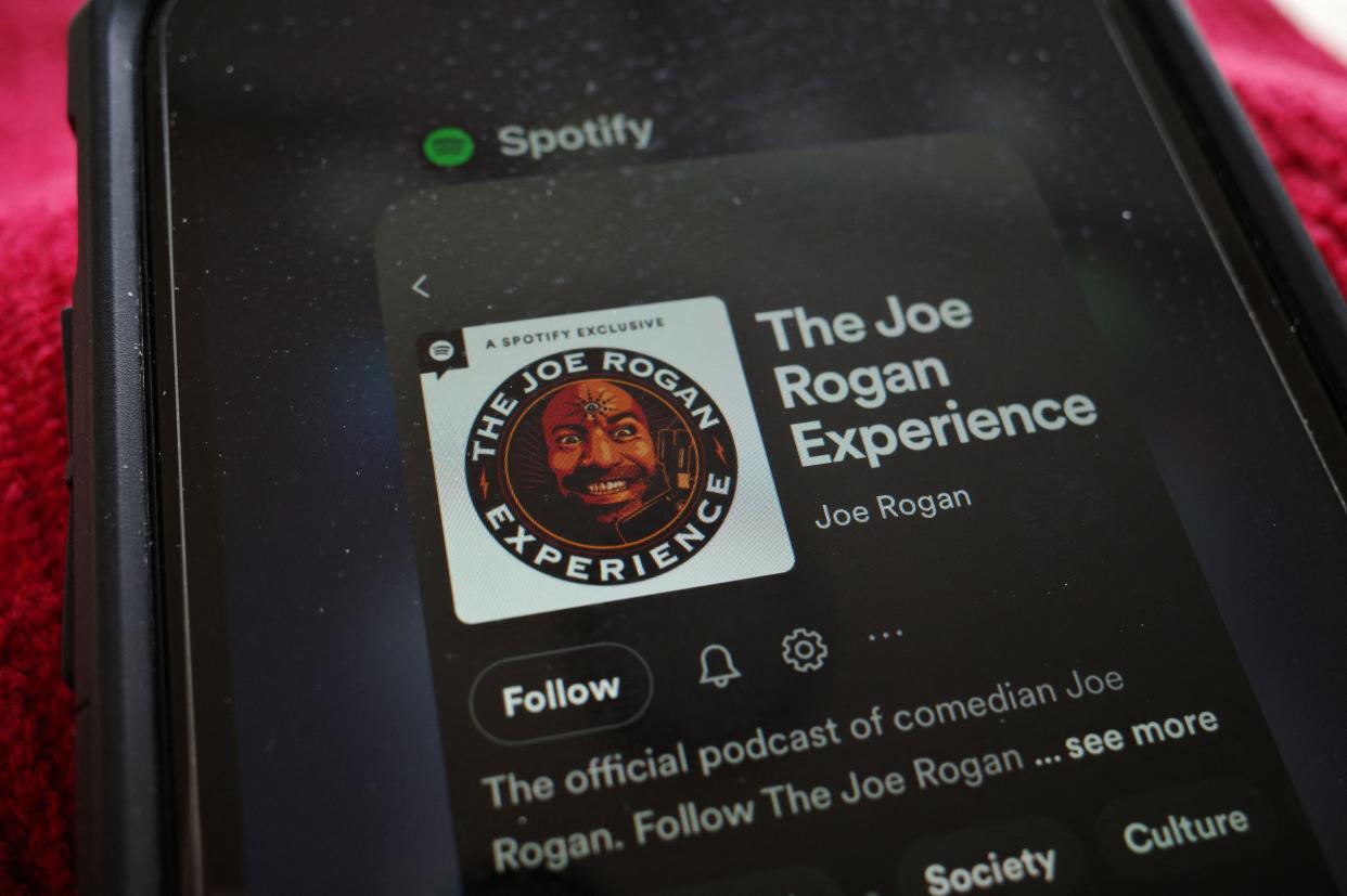 This illustration photo shows the Spotify page for "The Joe Rogan Experience" podcast displayed on a smart phone in Washington, DC on February 7, 2022.