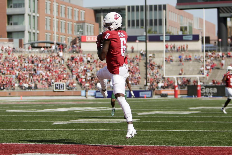 Washington State wide receiver Donovan Ollie catches a pass for a touchdown during the first half of an NCAA college football game against Colorado State, Saturday, Sept. 17, 2022, in Pullman, Wash. (AP Photo/Young Kwak)
