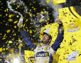 FILE - In this Nov. 20, 2016, file photo, Jimmie Johnson celebrates his NASCAR Sprint Cup auto race and season title win, in Homestead, Fla. Seven-time NASCAR champion Jimmie Johnson says 2020 will be his final season of full-time racing. The winningest driver of his era will have a 19th season in the No. 48 Chevrolet and once again chase a record eighth championship. Johnson made the announcement in a video posted on social media, Wednesday, Nov. 20, 2019. (AP Photo/Terry Renna, File)