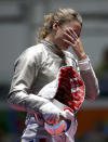 <p>Manon Brunet of France reacts after losing the women’s sabre individual bronze medal bout on August 8, 2016. (REUTERS/Issei Kato) </p>