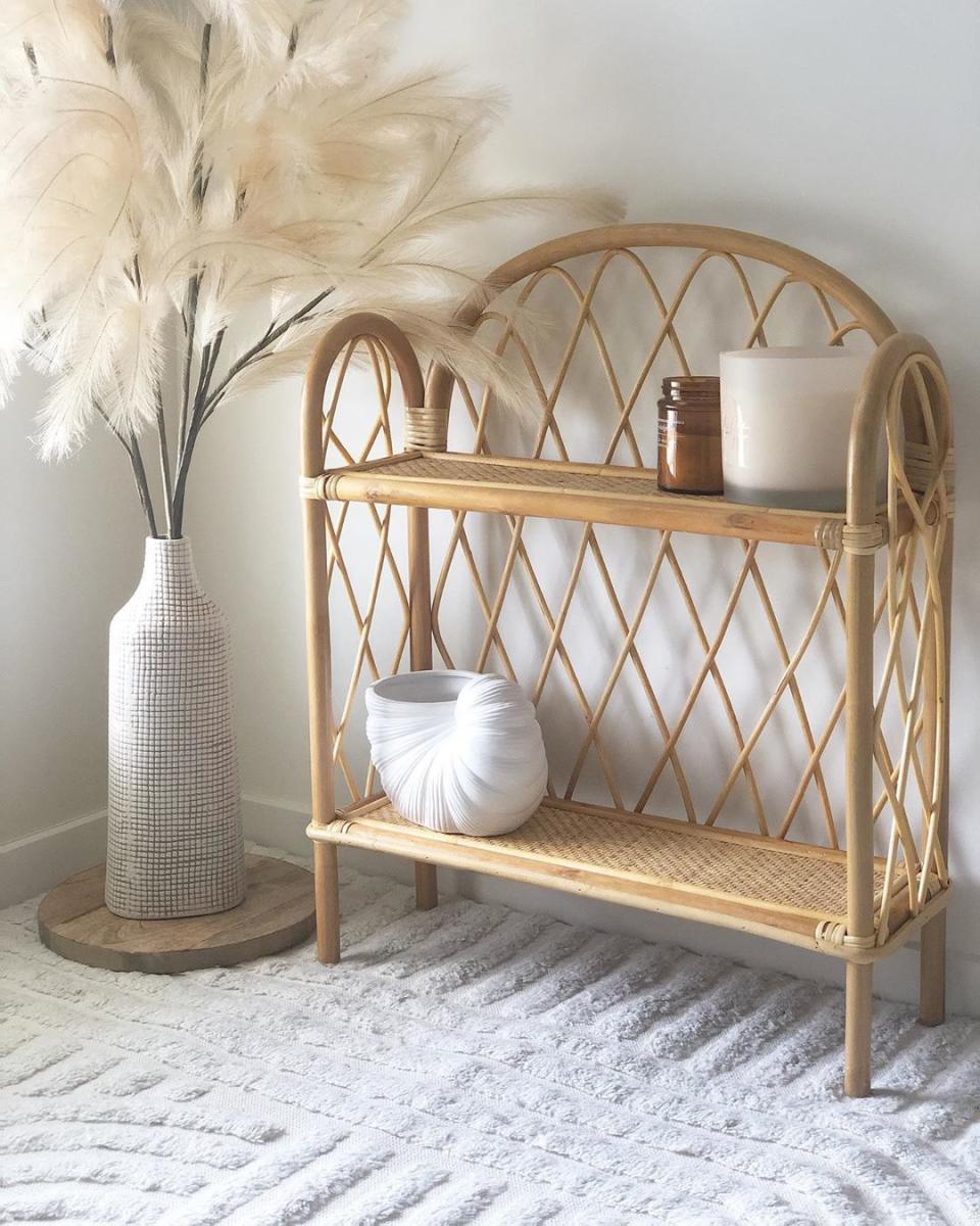 rattan bookcase from Big W styled in a shopper's home