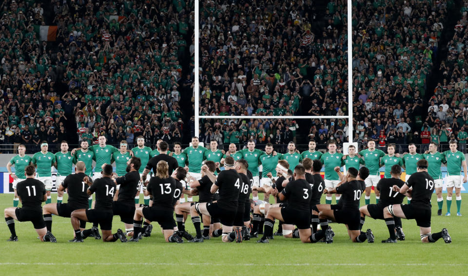 New Zealand's players perform haka ahead of the Rugby World Cup quarterfinal match at Tokyo Stadium between New Zealand and Ireland in Tokyo, Japan, Saturday, Oct. 19, 2019. (AP Photo/Eugene Hoshiko)