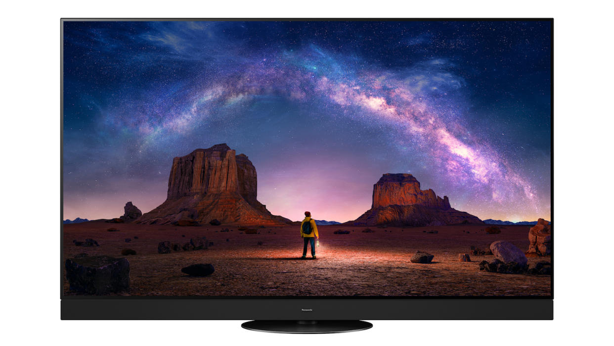  Panasonic Z95A OLED TV on a white background. On the screen is a person in a desert looking up at a star constellation. 